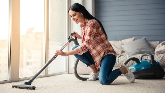 Lady cleaning carpet floor | Right Carpet & Interiors